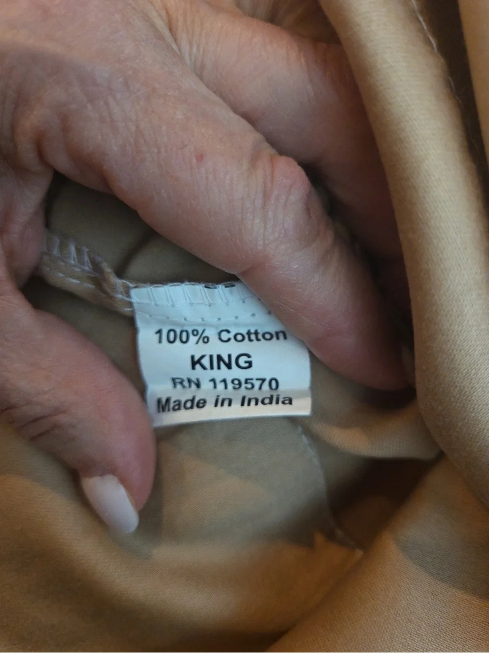 Three brown cotton king sized pillow cases